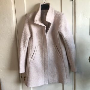 Cream colored funnel neck boucle coat